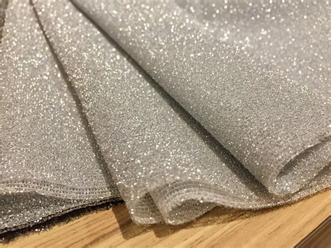 metallic silver glitter fabric|thin pieces of glittering material.